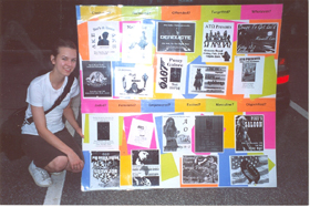 Claire Lauterbach with the exhibit of social scene posters. Claire Lauterbach with the exhibit of social scene posters.