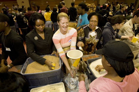 Duke student Alison Whitaker packages food at the Million Meals Event. 