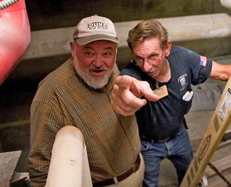 Jon Gardiner Ray Cofer, right, confers with supervisor Gary Teeter at work this past August.
