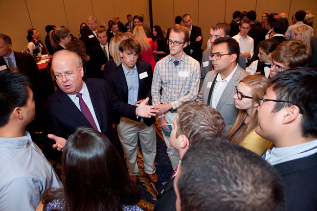 Karl Rove talks with students prior to the debate
