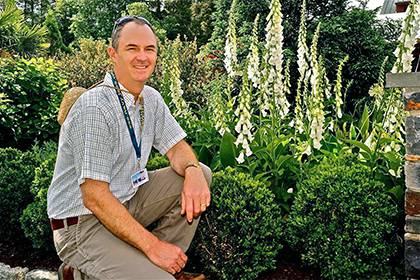 Bobby Mottern, director of horticulture at Sarah P. Duke Gardens, poses for a photo in the Page-Rollins White Garden at Duke. Courtesy of Bobby Mottern