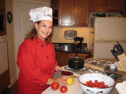 Kelly Deal, an associate in research at the Duke Global Health Initiative, prepares food at her home. Deal was one of several Duke employees to submit Thanksgiving recipes. Photo courtesy of Kelly Deal.