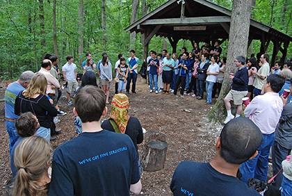 Faculty, staff and graduate students from the Department of Physics gather for their annual picnic at a picnic area in Duke Forest. Photo by Marsha A. Green.