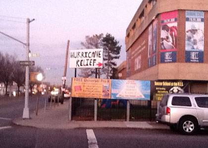 A hand-made sign in New York City points the way to help in the aftermath of Hurricane Sandy. Photo by Sancha Medwinter