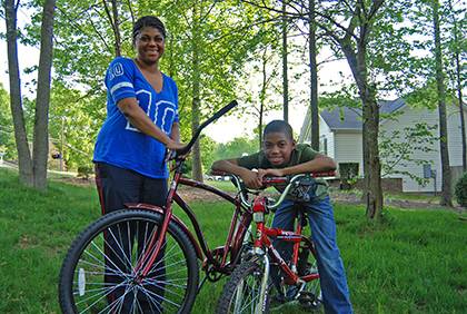 Carla Lipscomb and her son, Caleb, like to ride bikes together as a way to encourage a healthy lifestyle. Photo by Bryan Roth.