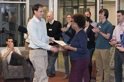 Glenda Lee offers a certificate of completion for Rising TIDE (Training for Inclusion & Diversity) to Matt Rogan, one of the 23 students at the Nicholas School of the Environment who participated in the new program. Photo by University Photography.