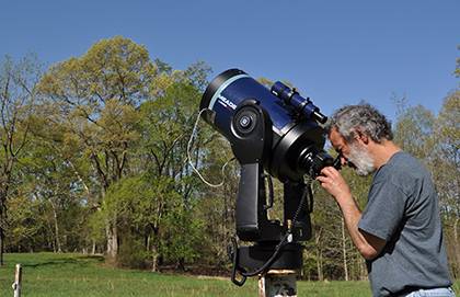 Ronen Plesser, a Duke professor of physics, runs the Duke Teaching Observatory in Duke Forest. Photo by April Dudash