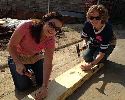 Christy Lohr Sapp, on right, joins other Duke Religious Life staff members during a Habitat for Humanity volunteer day. Photo courtesy of Christy Lohr Sapp. 