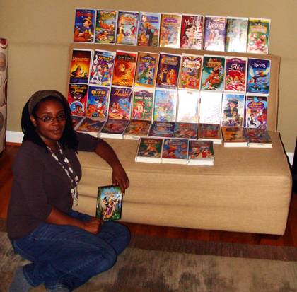 Kimberly Walker poses at home with a collection of her Disney movies. Photo courtesy of Kimberly Walker