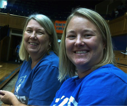 Bonnie Conner, left, poses for a photo in Cameron Indoor Stadium with her daughter, Melissa Murray, a nurse manager at Duke Regional Hospital. Conner enjoys going to volleyball games with her family at the historic Duke building. Photo courtesy of Bonnie
