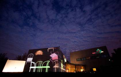 Film images move across the walls of the Nasher Museum of Art during the showing of