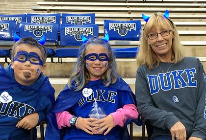 Dink Suddaby, right, poses for a picture with niece and nephew Katie and Zachary before a Duke football game against University of Miami on Halloween. Photo courtesy of Dink Suddaby.
