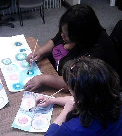 Members of the Mood Disorders Support and Education Group paint pictures as part of a group session. It's one way participants learn to deal with problems. Photo courtesy of Cynthia Jones.