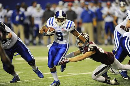Duke running back Josh Snead breaks a tackle during the Blue Devil's appearance in the Chick-fil-A Bowl in December. Employees can catch Snead and other players in 2014 for a deeply discounted ticket price. Photo courtesy of Duke Athlietcs.