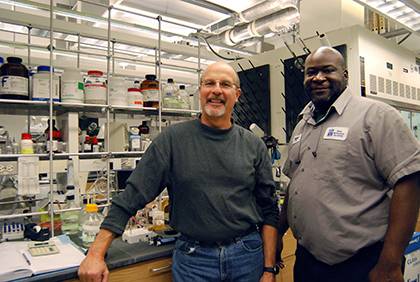 Bob Mook, left, received help from Rodney Terrell when vials of anti-cancer drug research went missing. Terrell helped Mook recover years of work and research. Photo by Bryan Roth.