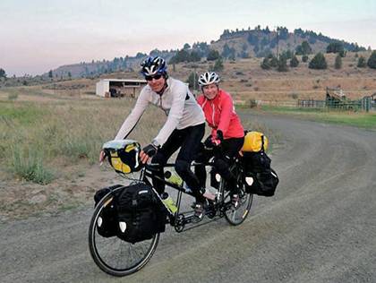 Duke biology professor Kathleen Smith and her husband, Bill Kier, ride out of camp in Paulina, Oregon. They made a pit stop because their route was detoured due to forest fires. Photo courtesy of Kathleen Smith