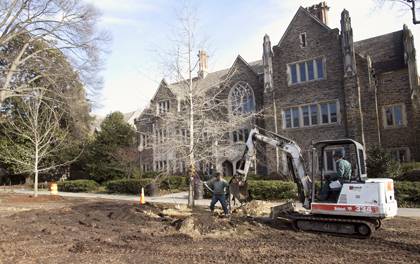 A Facilities Management crew plants new trees by the Allen Building in 2011. The planting was part of Duke's ongoing tree-care plan. Photo by Duke Photography.