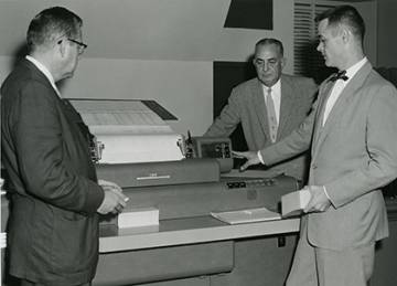 From left, G.C. Henricksen, A.S. Brower, and Kenneth Manning pose by an IBM computer in 1954. The technology wasn't what we're used to today, but could be used for tasks such as math equations. Photo courtesy of University Archives.