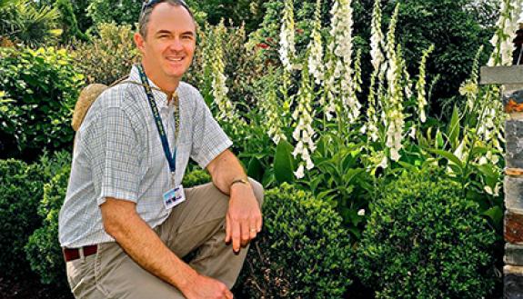 Bobby Mottern, director of horticulture at Sarah P. Duke Gardens, poses for a photo in the Page-Rollins White Garden at Duke. Courtesy of Bobby Mottern