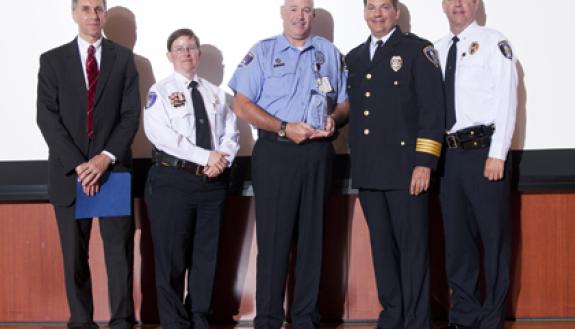Scott Grainer, center, security officer with Duke Police, was presented with the Chief's Award during Duke Police's annual awards ceremony July 17. Photo by Duke Photography.