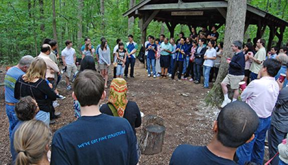 Faculty, staff and graduate students from the Department of Physics gather for their annual picnic at a picnic area in Duke Forest. Photo by Marsha A. Green.