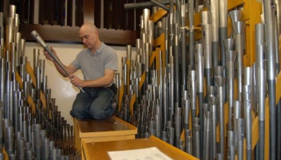 John Santoianni spends much of his time high up in the Duke Chapel with the pipes of the Aeolian Organ installed in 1932. Photo by Marsha A. Green.