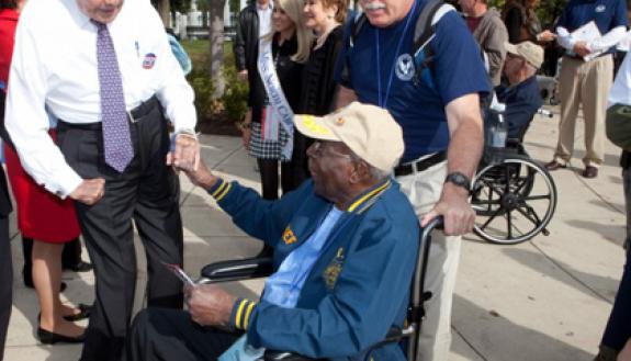 Mike Snyder, right, travels with World War II veterans to Washington, D.C. On a recent trip, he accompanied a veteran as they met former Sen. Bob Dole. Photo courtesy of Mike Snyder.