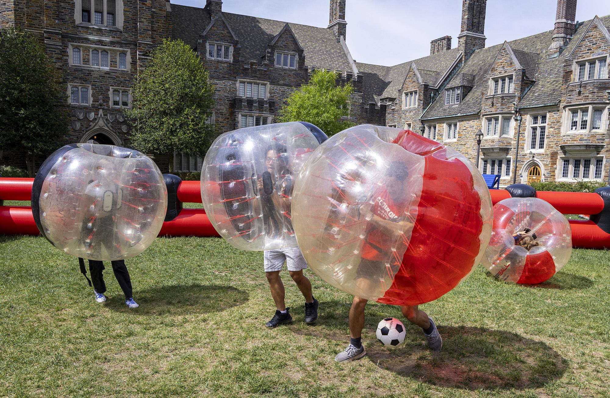 Students bounce off each other while playing bubble soccer on the Crowell Quad during LDOC. 