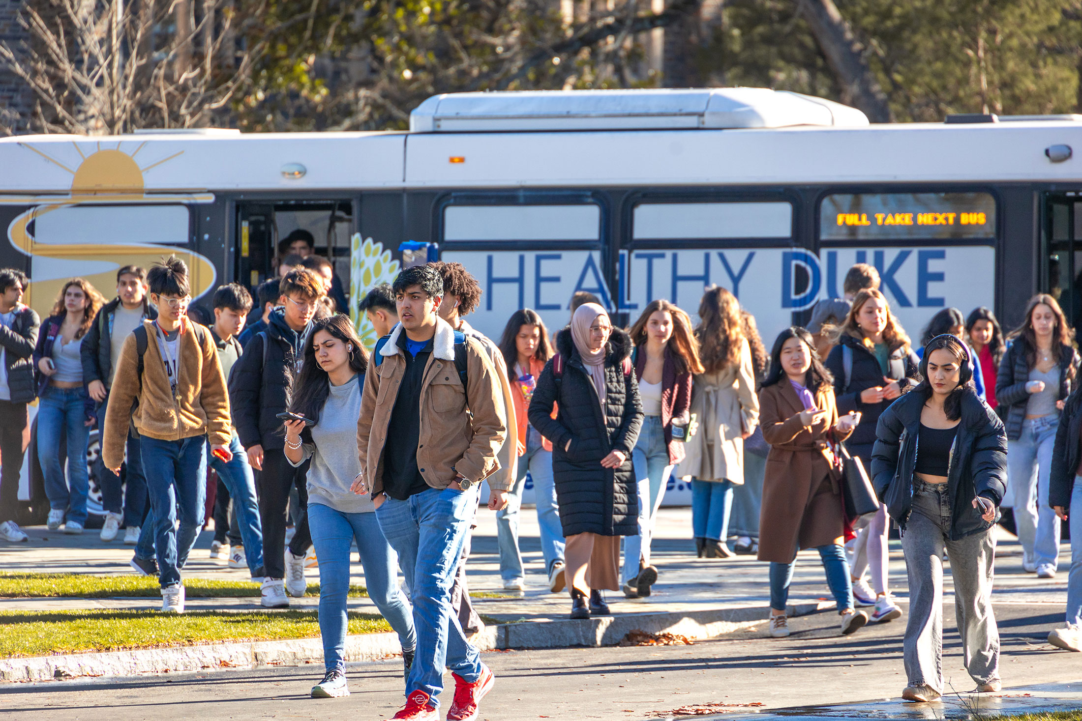 students at the West Campus bus stop
