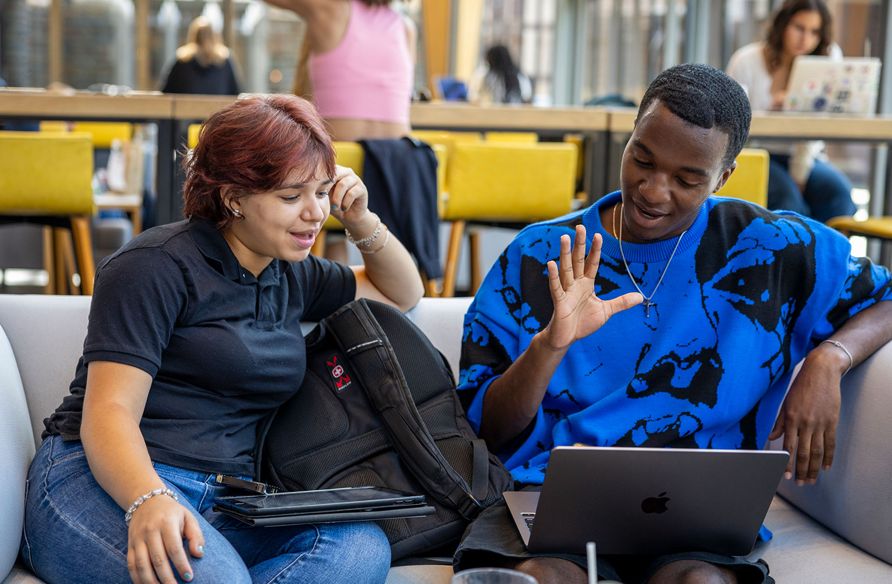 First-years Paulina Vidriales and George Ofori read each other’s college essays.