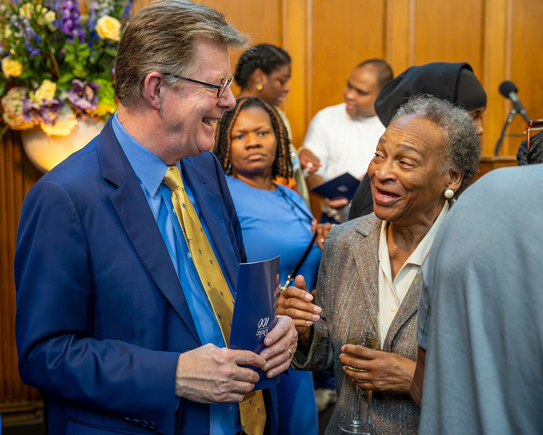 President Vincent Price talks with Audrey Mitchell, president of Walltown Community Association.