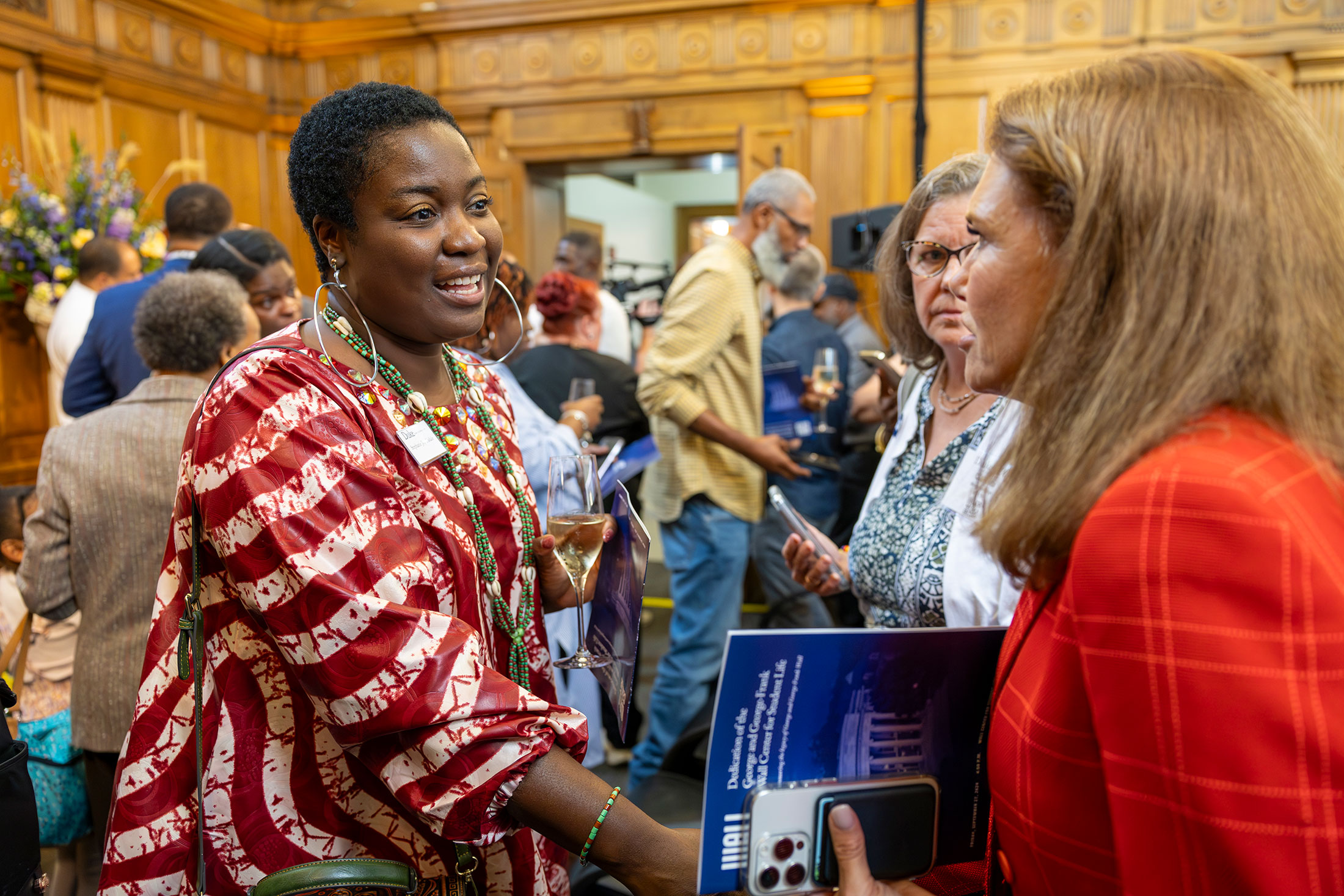 Stephanie Joy Tisdale, great-great-great-granddaughter of George Wall talks with university trustee Amy Abernethy.