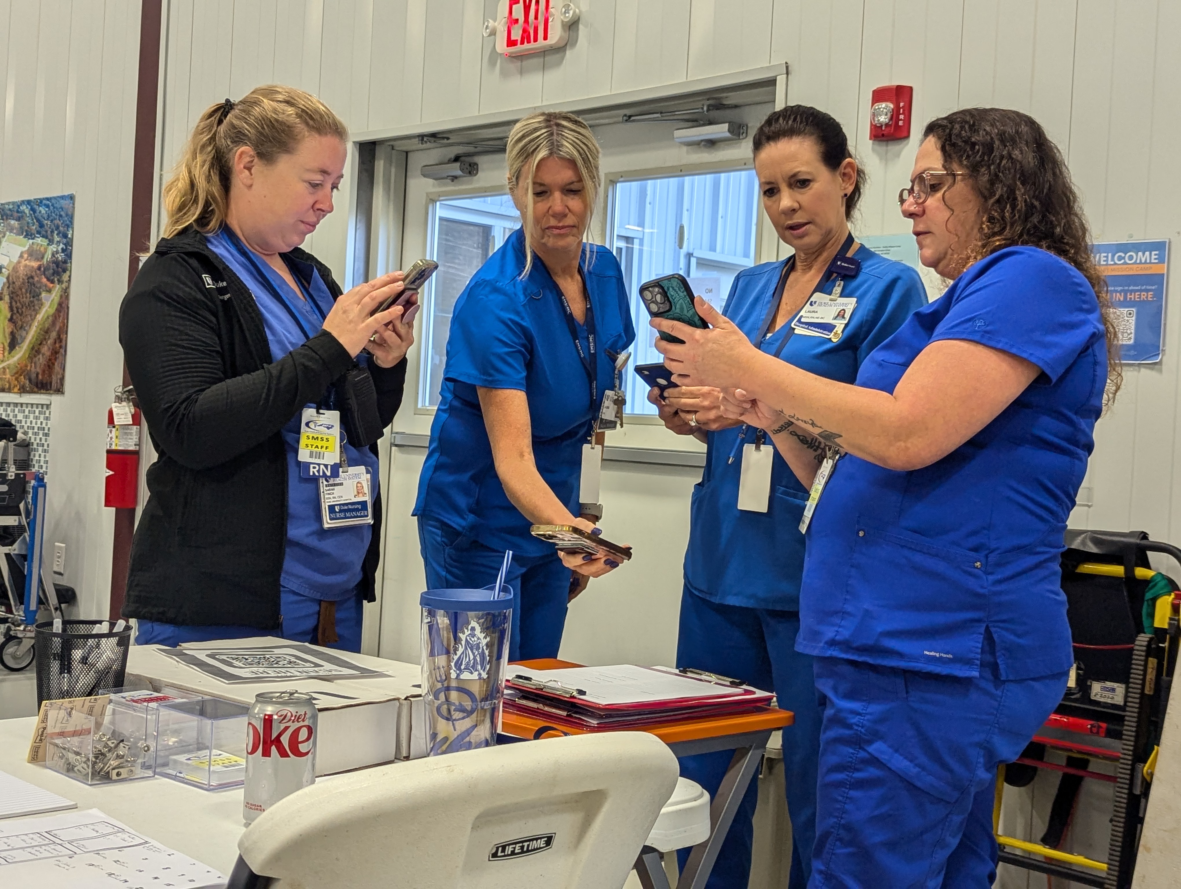 Nurses working together at a station