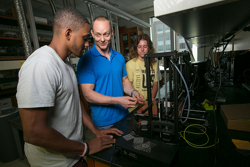 Ken Gall in the materials lab explaining his work to students