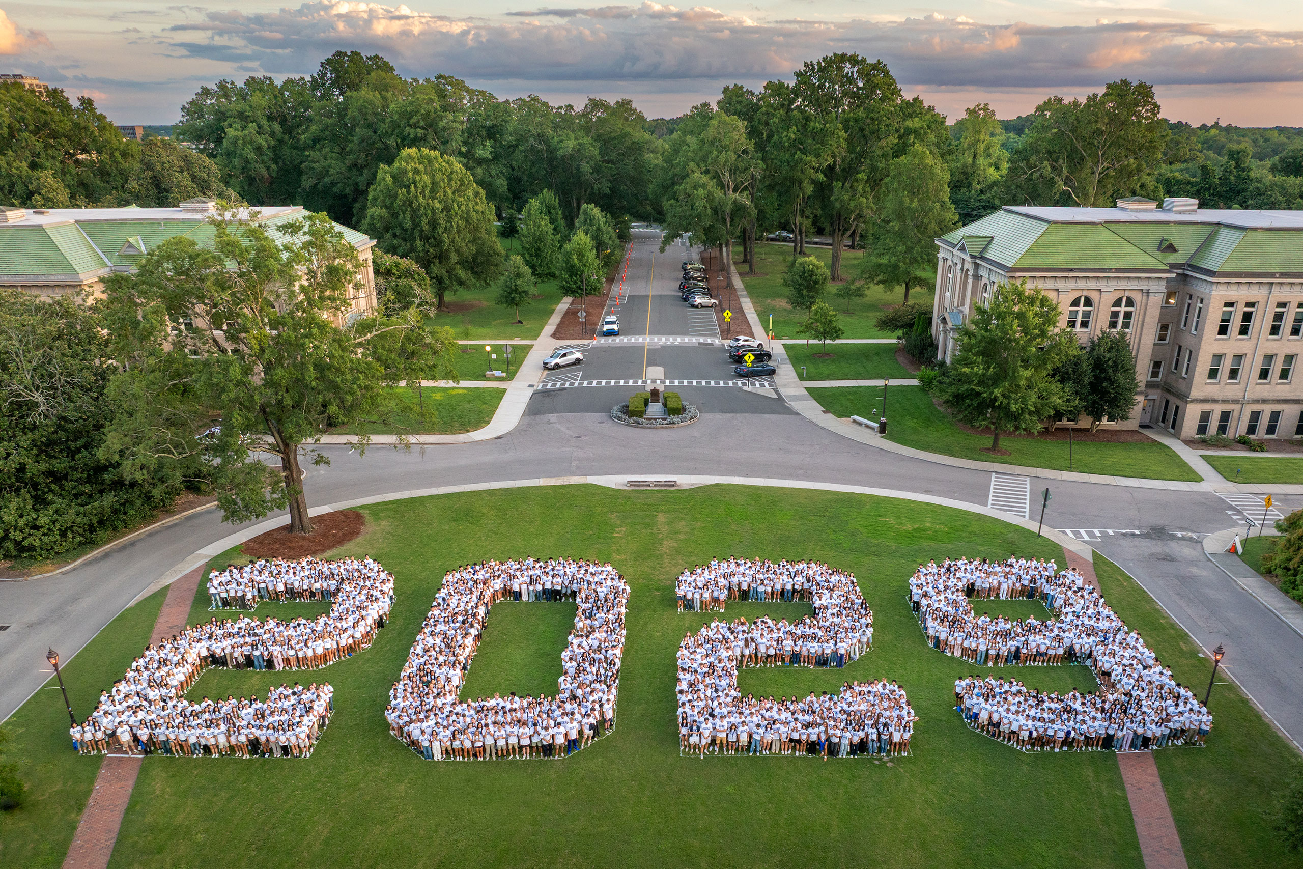 An aerial view of the Class of 2029 lined up to spell out 2029 on East Campus at sunset