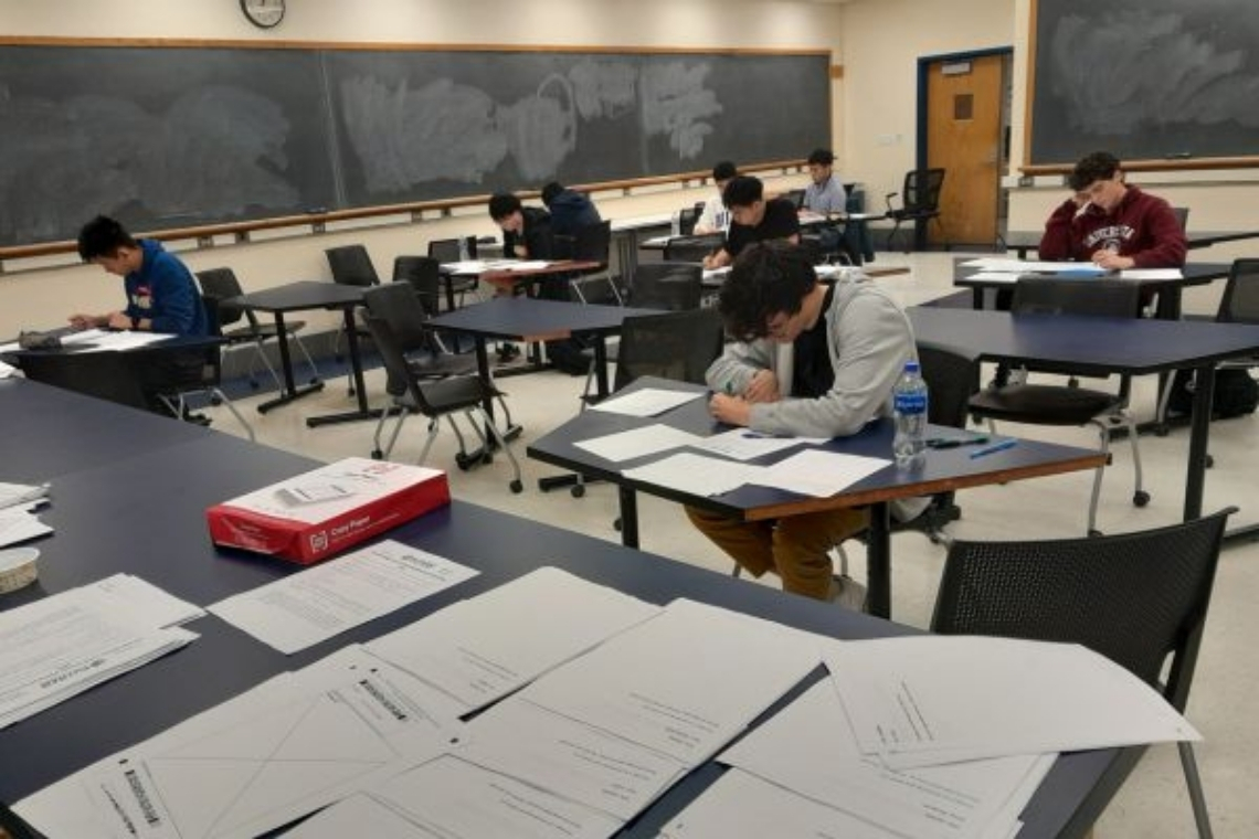 photo of students sitting for n all-day math marathon.