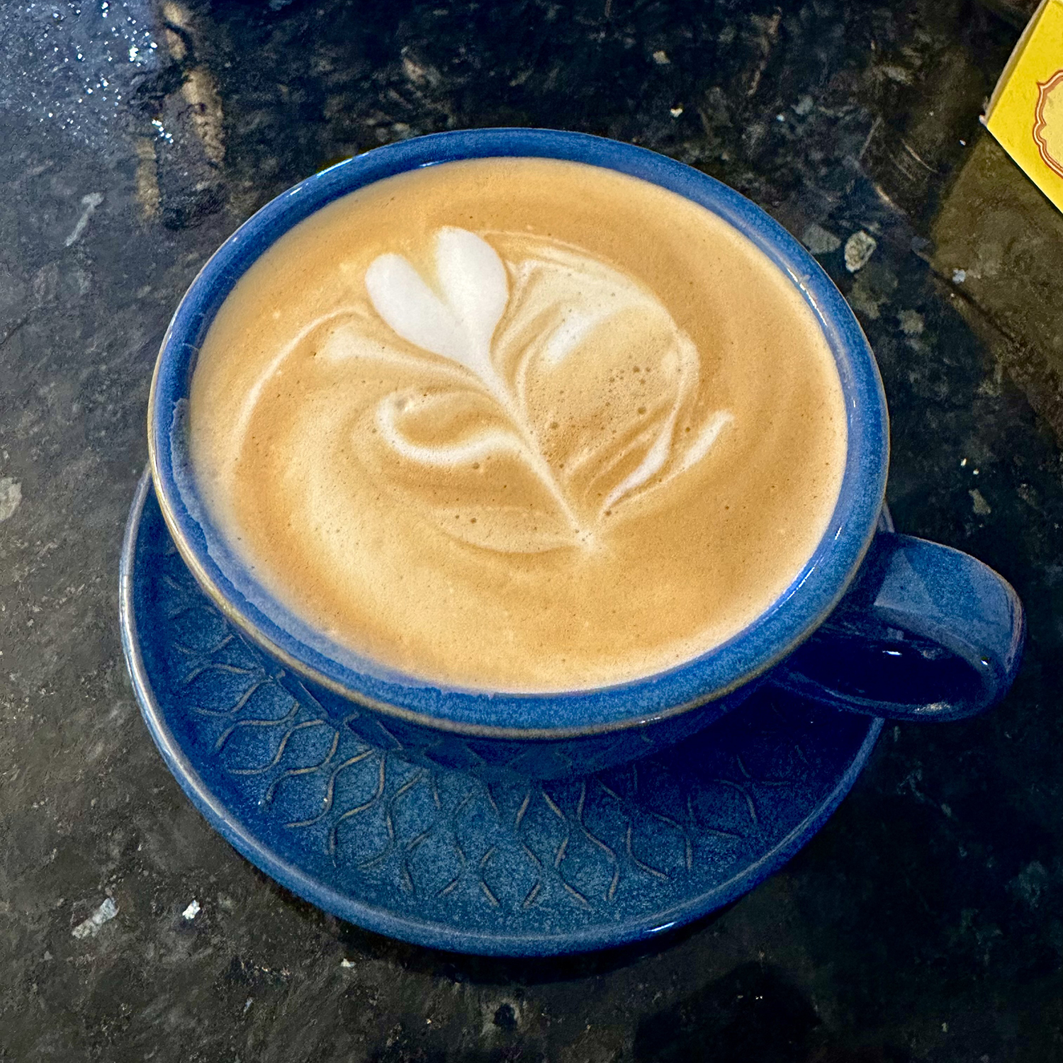 Adrian Camarena's artistic approach to the steamed milk that tops his coffee drinks has delighted his colleagues. Photo by Adrian Camarena.