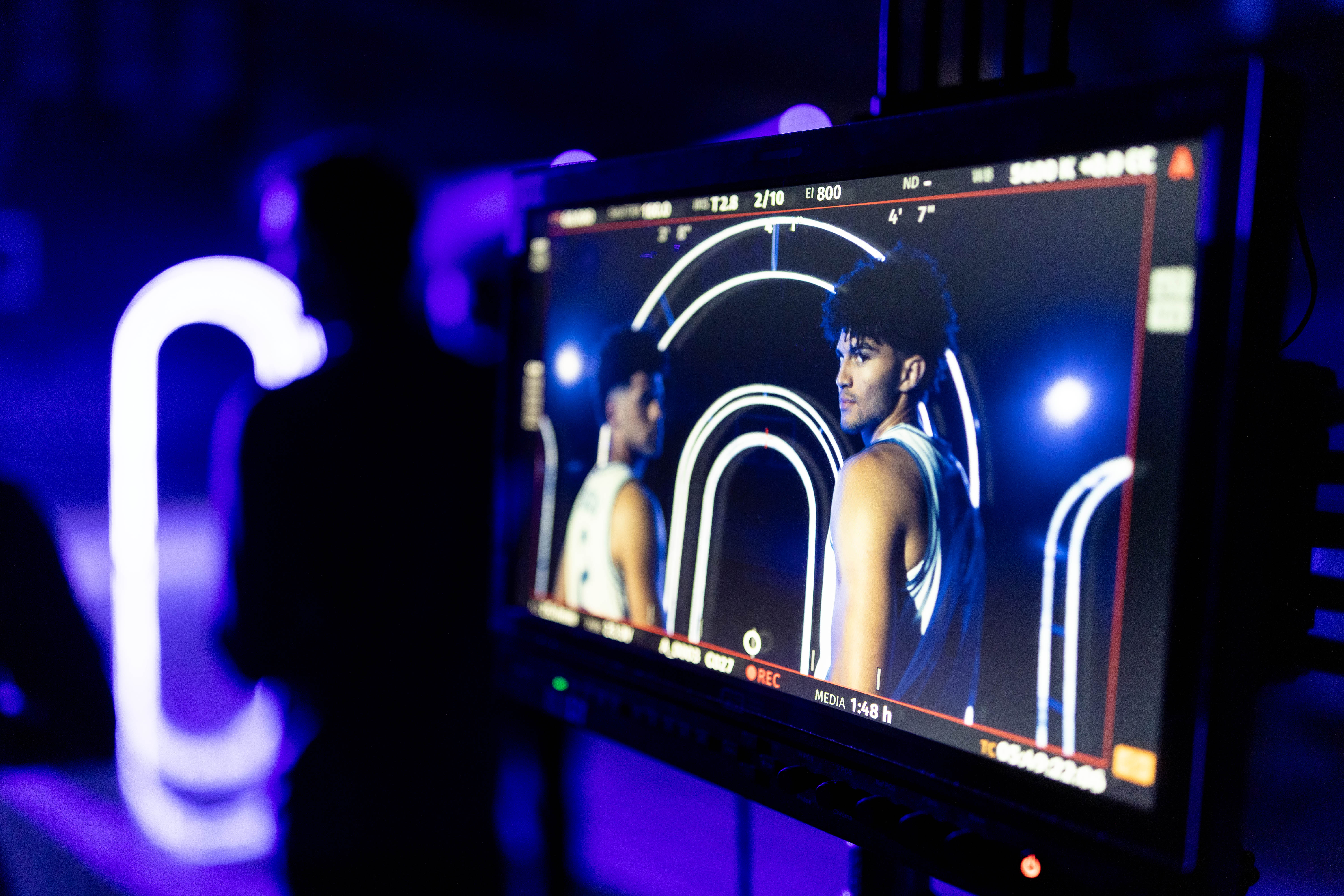 Cayden and Camden Boozer are shown on a video screen during a Duke men's basketball photo shoot 