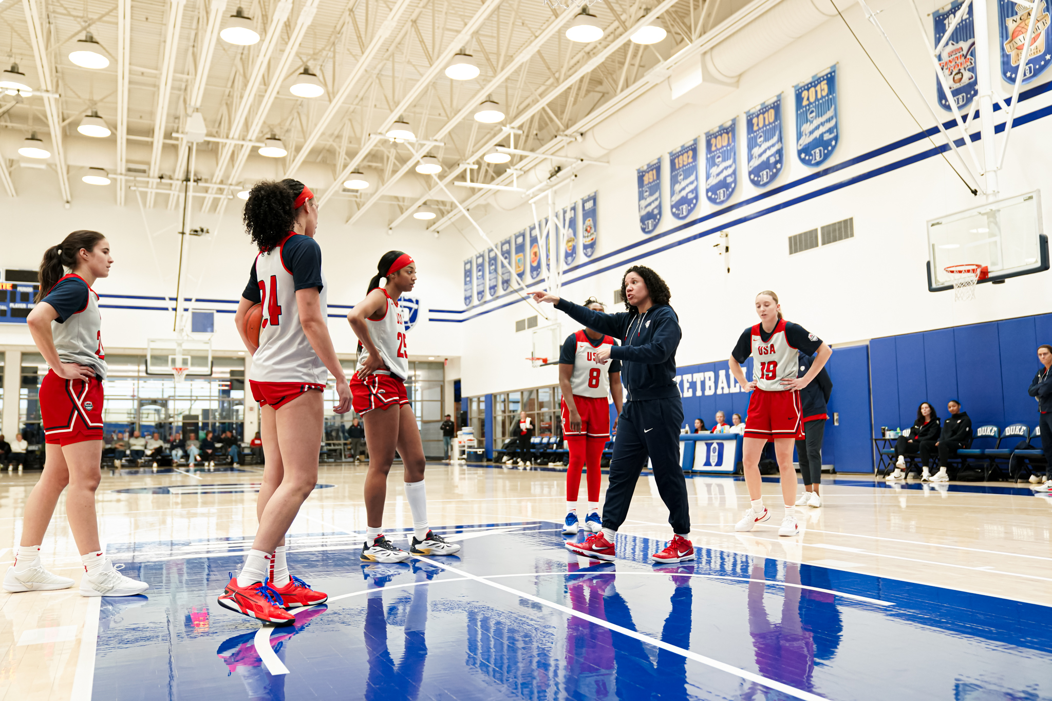 Several basketball players on a court