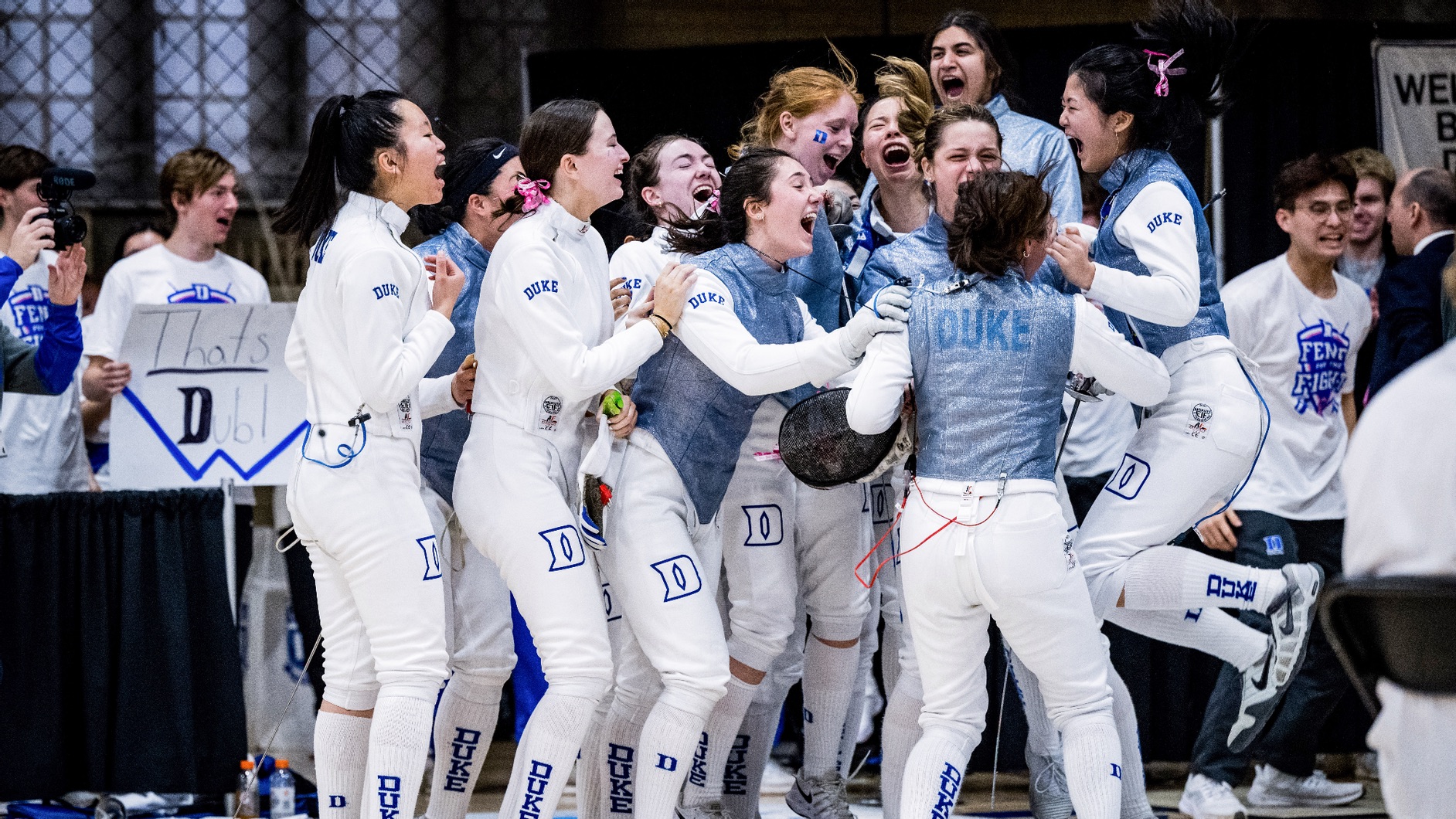 Duke fencers celebrate a victory this past February in Card Gym.