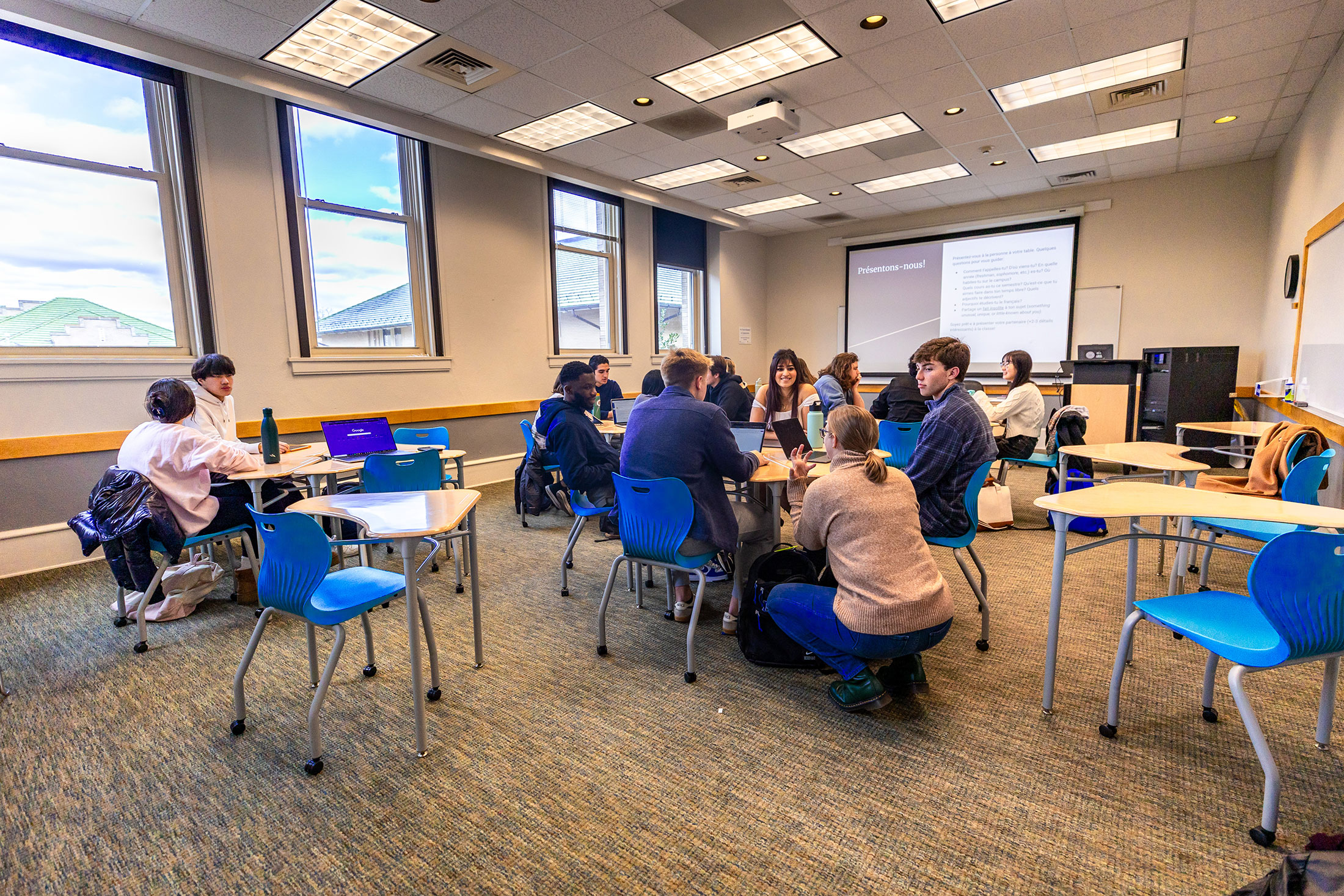 Sandra Valnes Quammen talking with students in her Intermediate French Language and Culture class.