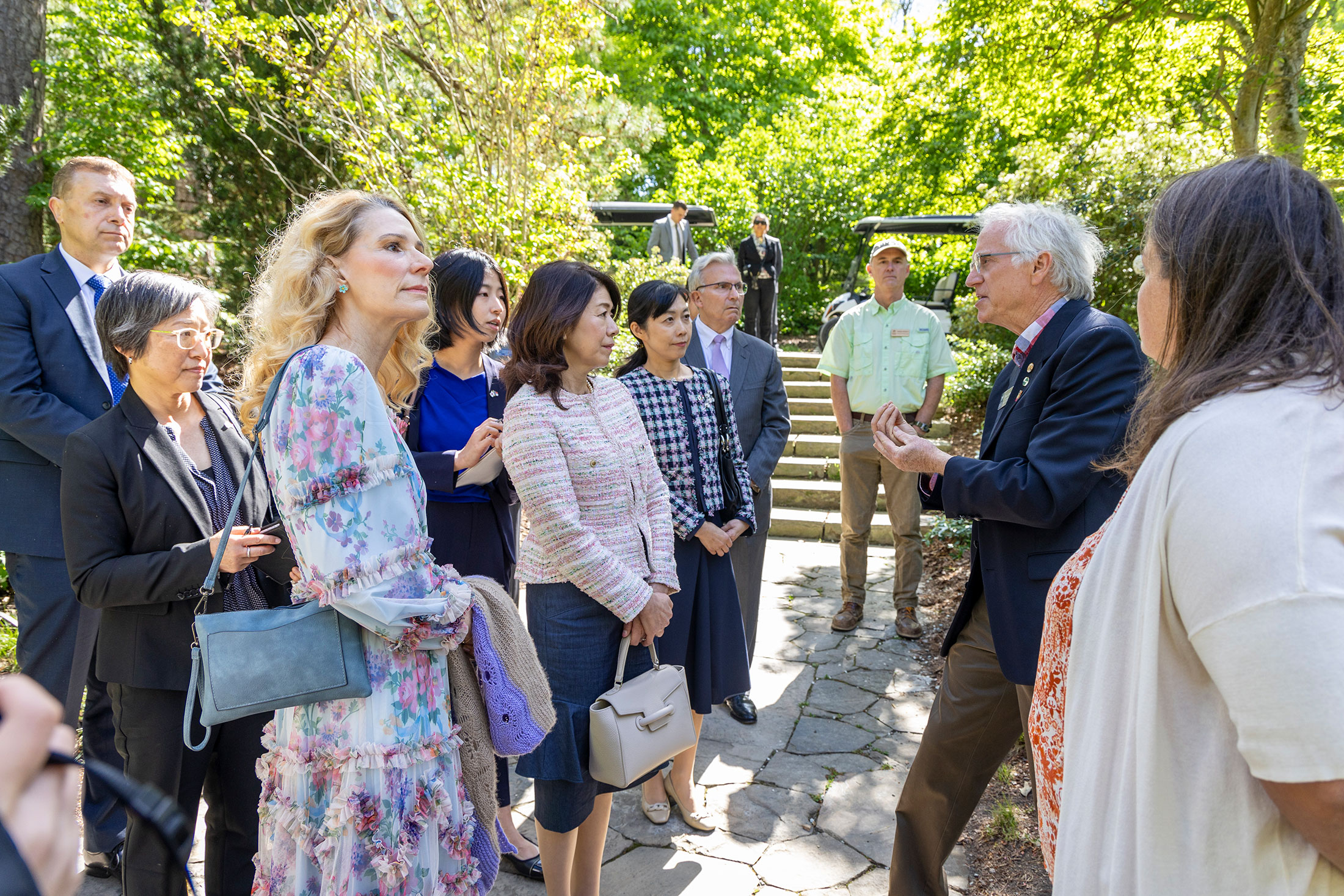 Paul Jones, right, curator of the Asiatic Arboretum, talks with, from left, Kristin Cooper, first lady of North Carolina; Yuko Kishida, spouse of the prime minister of Japan; Mio (Yamamoto) Maeda, spouse of the consul general of Japan in Atlanta, and Bill LeFevre, executive director of the Gardens, in the Durham-Toyama Sister Cities Japanese Pavilion.