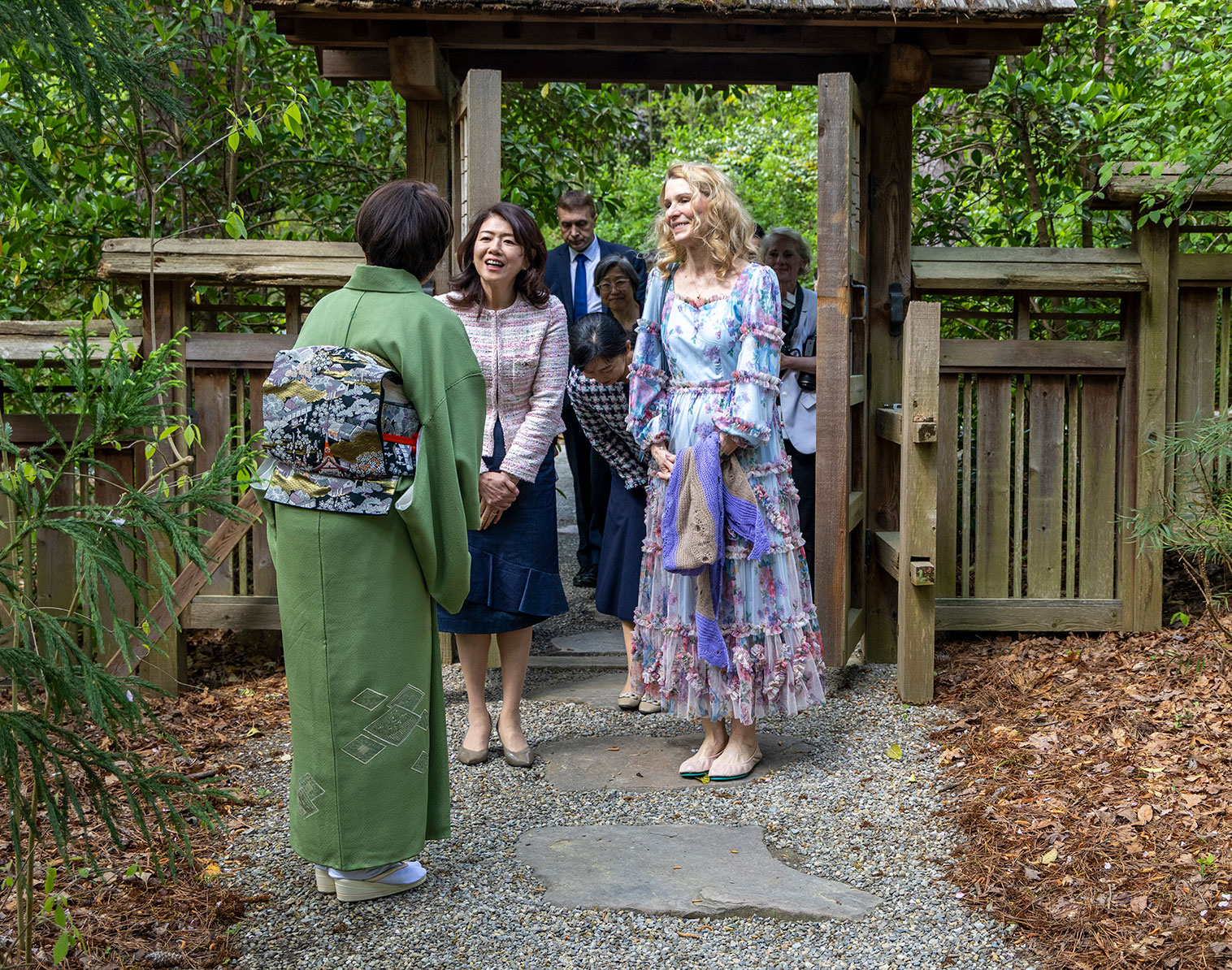 Chizuko Sueyoshi greets Yuuko Kishida and Kristin Cooper.