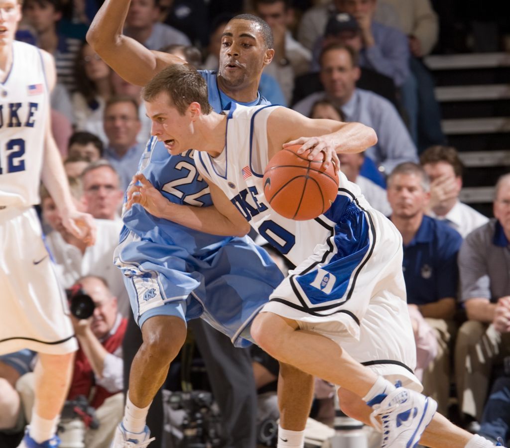 Jon Scheyer drives past a UNC player during a game in 2009.