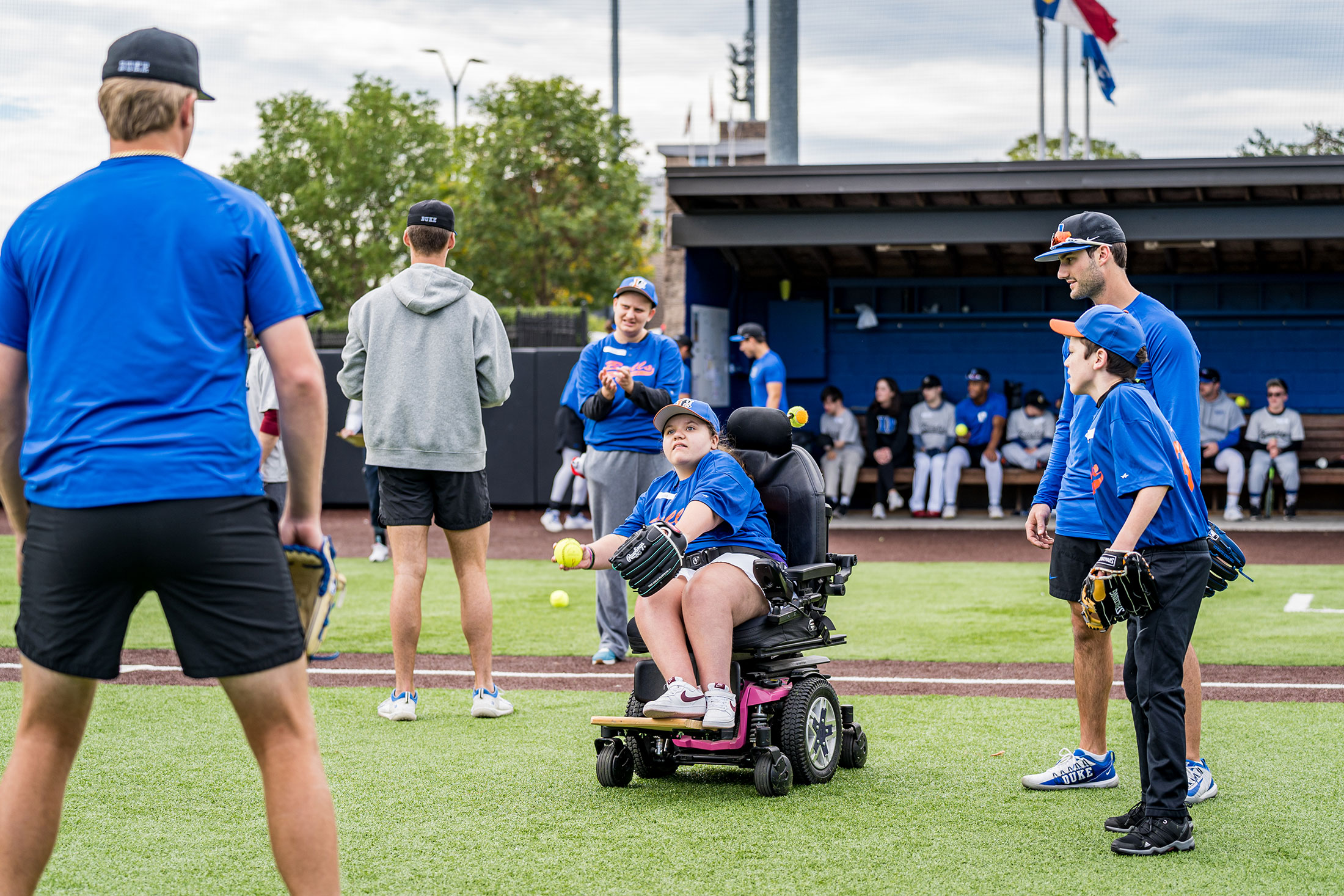 Duke baseball players toss around the ball with Miracle League players.
