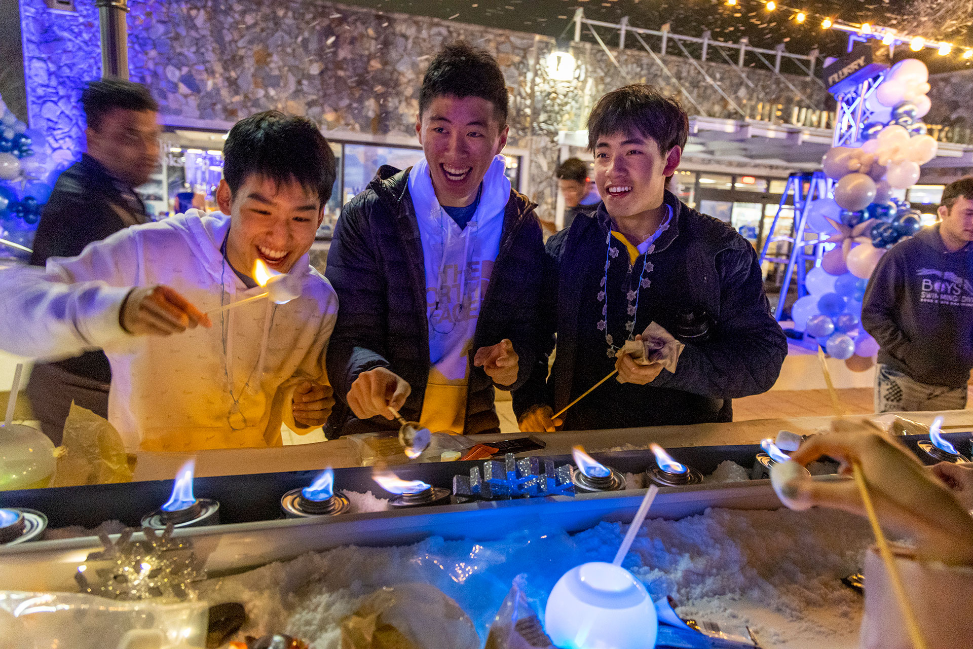 Students cook s‘mores over an oven during Winter Chill. Photo by Jared Lazarus.