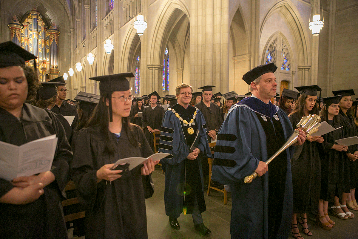 Academic Council Chair Don Taylor leads President Vincent Price in the baccalaureate procession Friday. Photo by Jared Lazarus