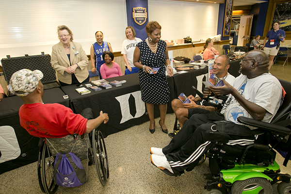 Duke Human Resources staff hand out recruitment brochures Wednesday to competitors in the Valor Games, in which wounded, ill or disabled service members compete in different athletic events. 