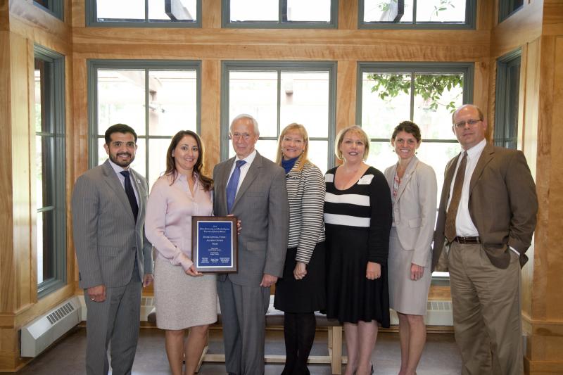 The Duke Annual Fund's Alumni Giving Program team poses with Duke President Richard H. Brodhead after receiving the Teamwork Award.