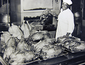 In this undated photo, presumably from late 1951, a Duke Dining employee shows a collection of turkeys roasted as part of a study for the National Turkey Federation. Photo courtesy of University Archives.